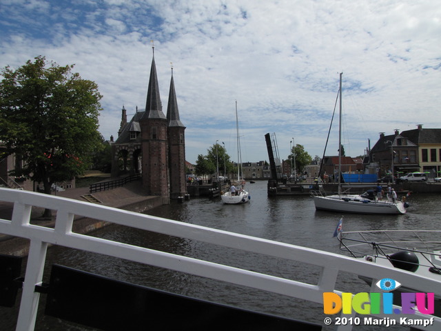 SX15249 Sailboats at Waterport in Sneek passing bridge in Lemmerweg